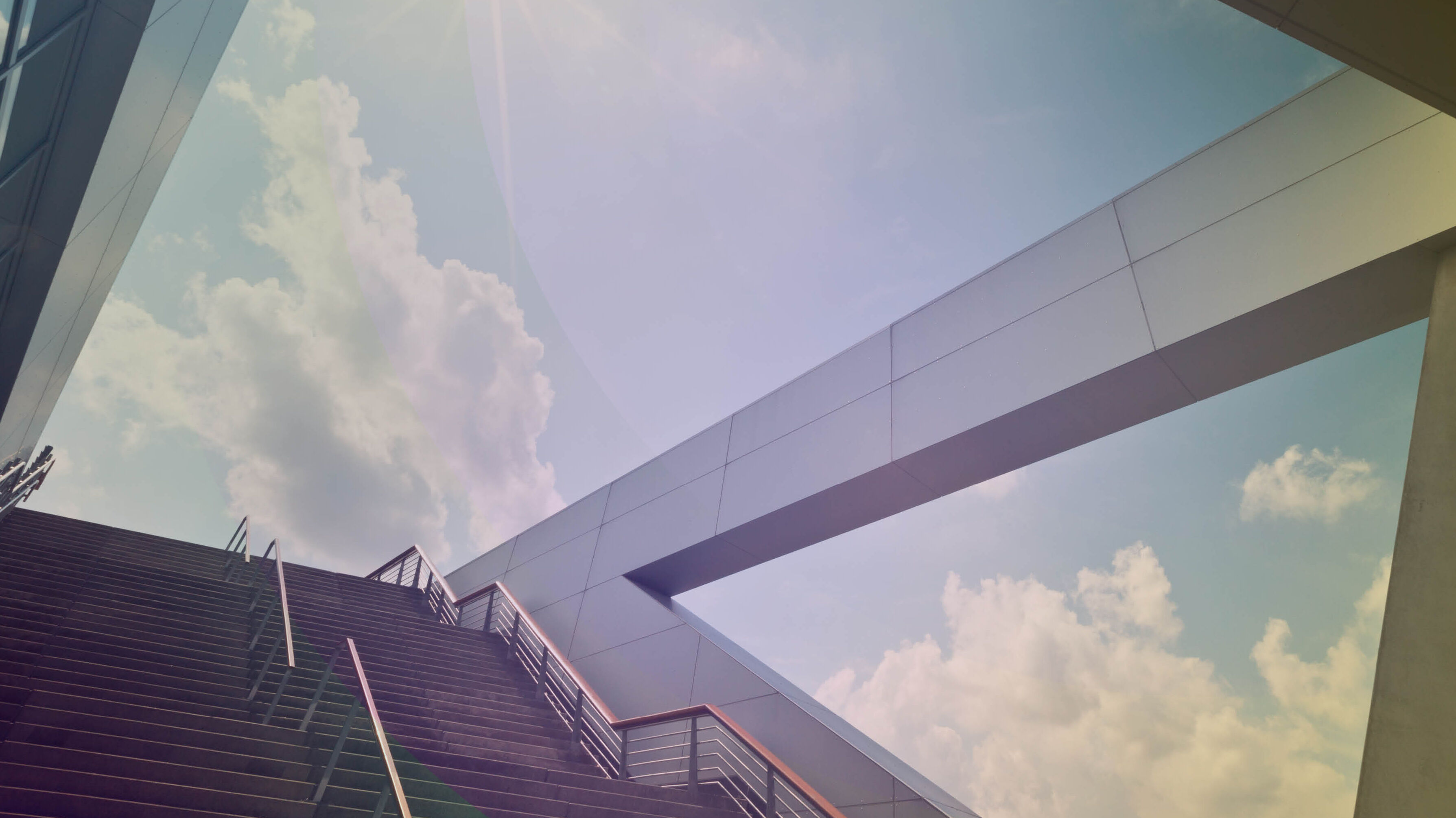 Staircase with a view of the cloudy sky