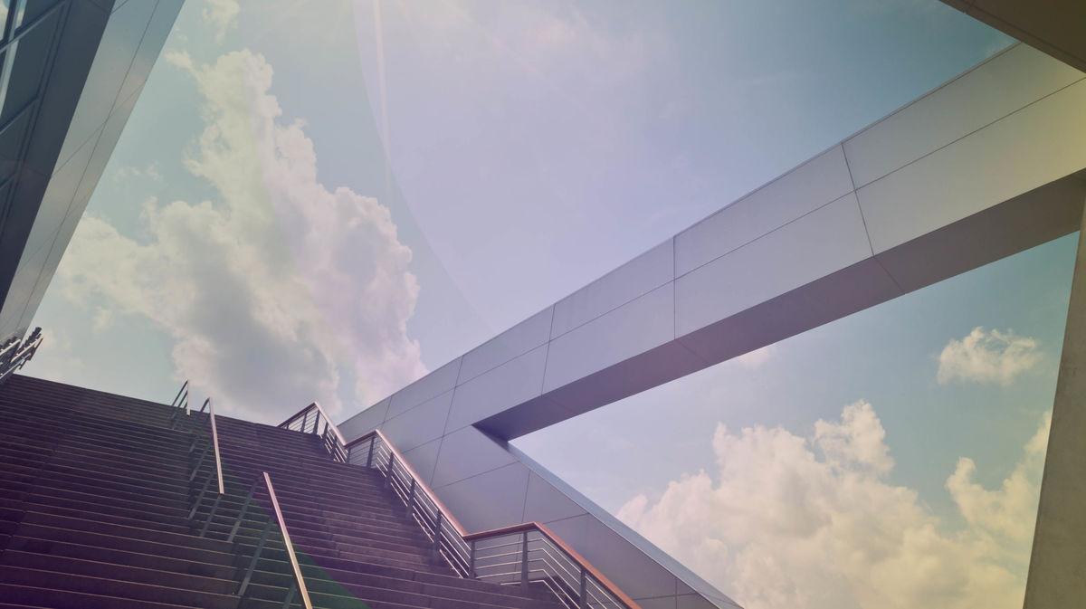 Staircase with a view of the cloudy sky