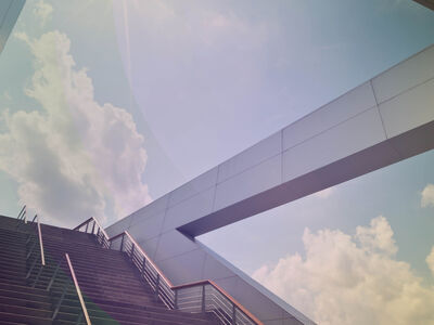 Staircase with a view of the cloudy sky