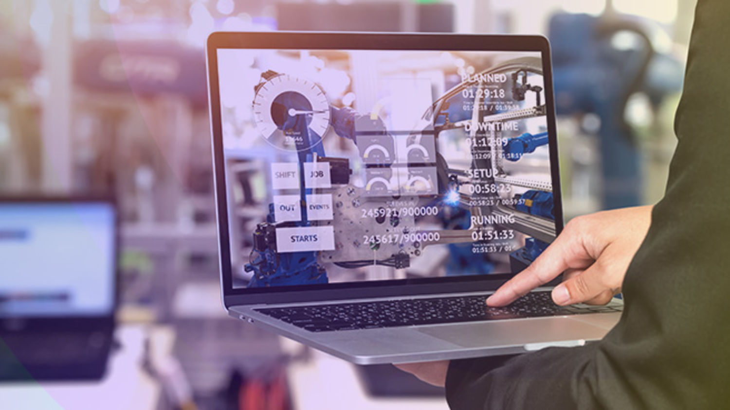 Man with laptop in an industrial plant