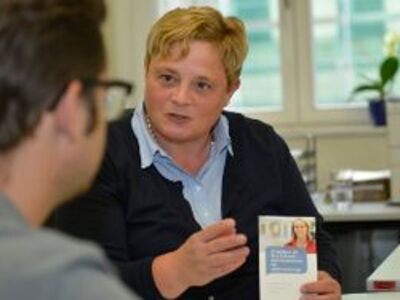 Two people engaged in a counselling session