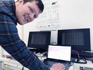 Stefan-Lukas Gazdag, crypto researcher at genua GmbH, in front of a PQC demonstrator