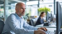 Man sits at an office desk