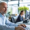 Man sits at an office desk